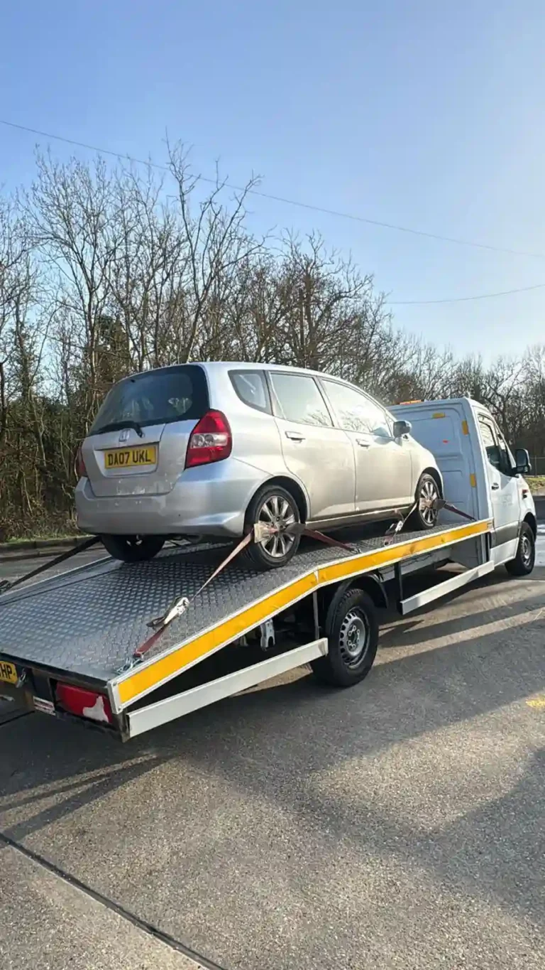 24/7 breakdown recovery flatbed tow truck providing emergency roadside vehicle recovery in the UK.